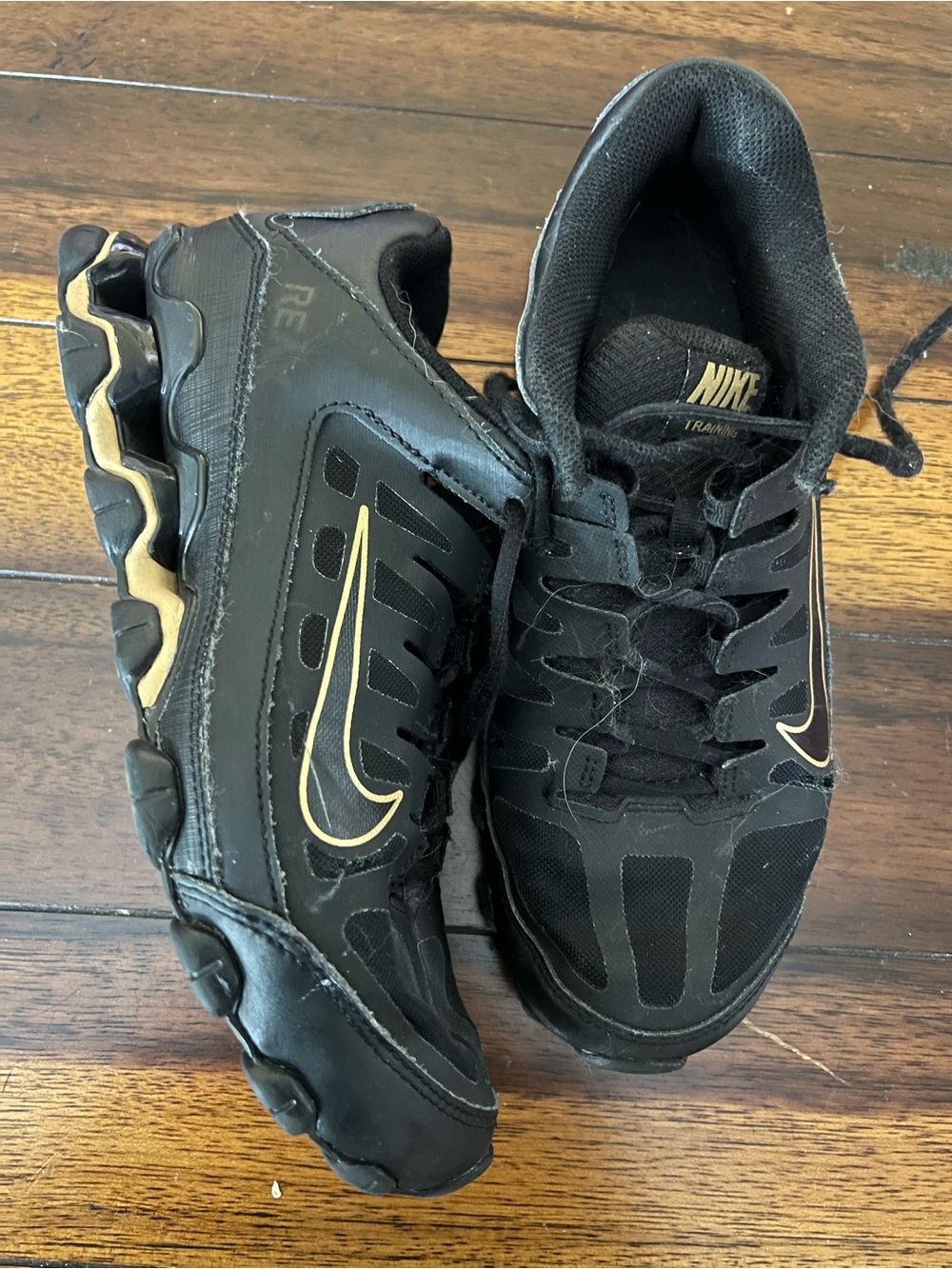 Nike Men’s Black Sneakers with Gold Accents